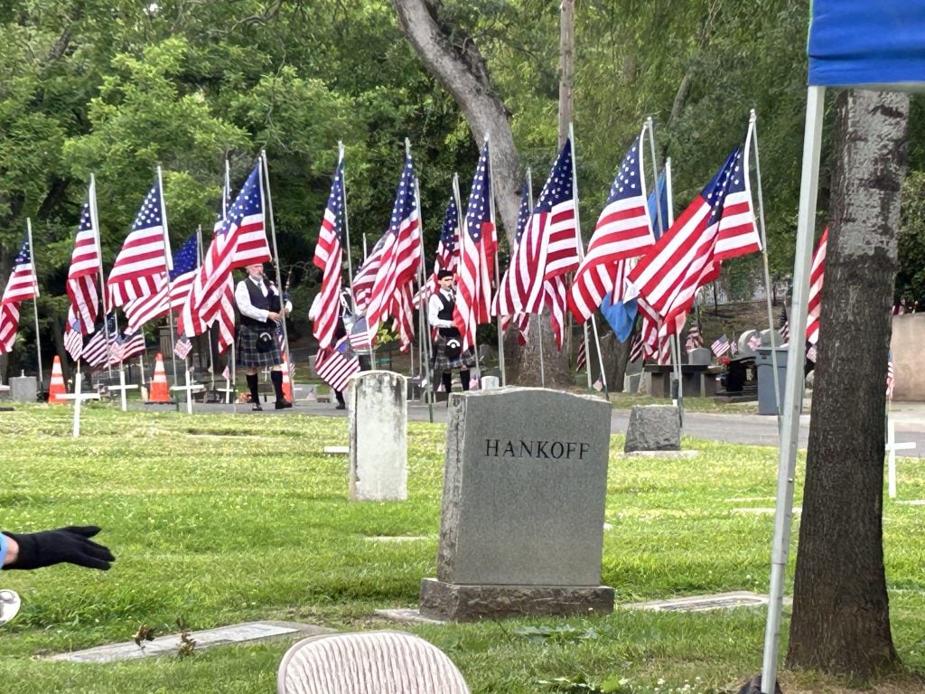 large flags lining the cemetery